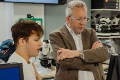 Dr Andrew Pridmore with student at the University of Leeds