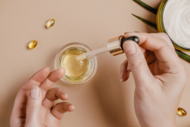 Hands with beauty products open on table